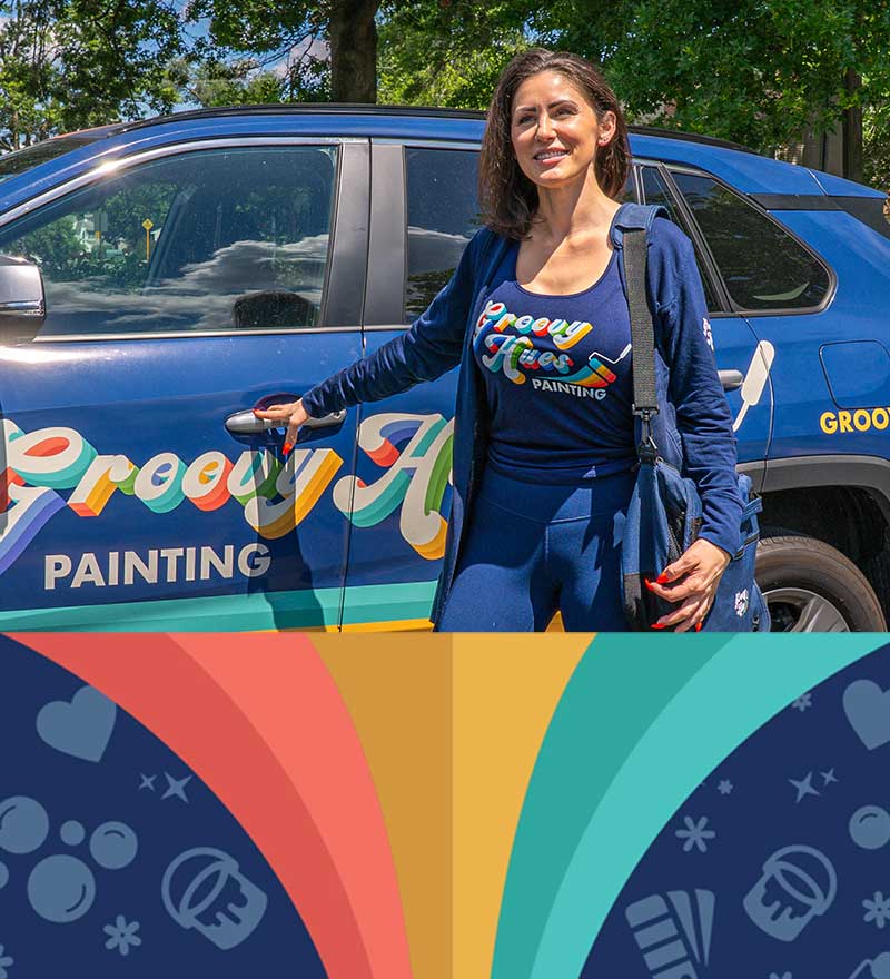 Groovy Hues Painting of Philadelphia owner with the brand-wrapped company vehicle in a local neighborhood
