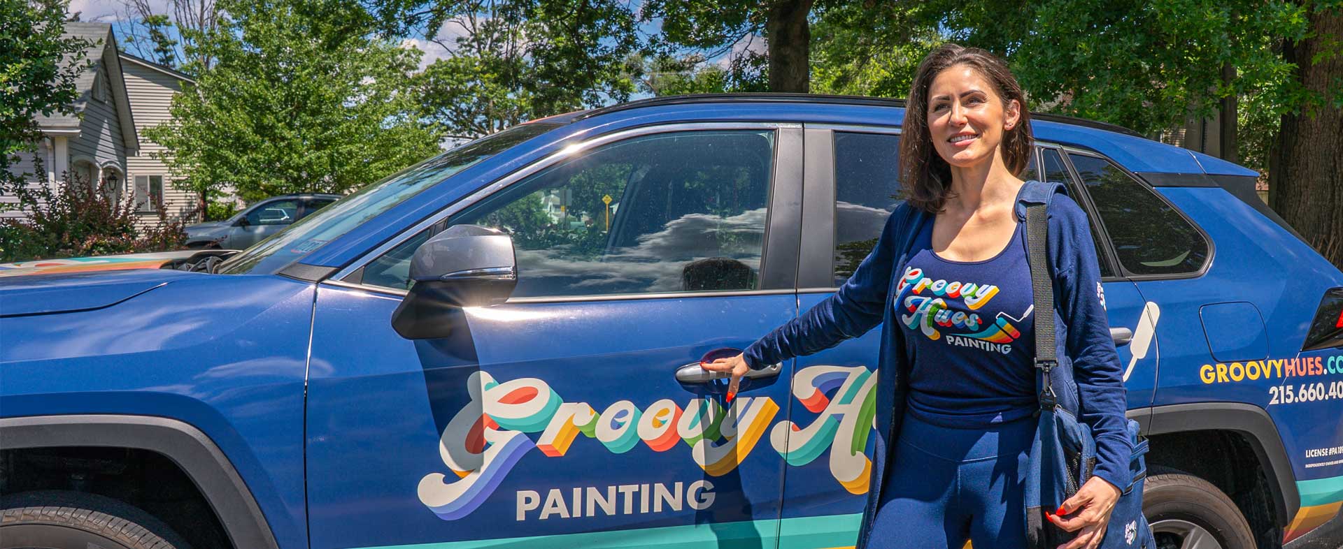 The Groovy Hues Painting of Philadelphia team with the brand-wrapped company vehicle